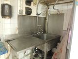 a kitchen with a sink and a stove in it