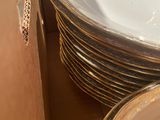 a lot of plates and bowls in a box