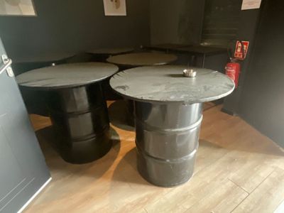 two tables that are sitting next to each other on the floor