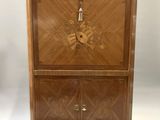 an antique wooden cabinet with marble top and drawers
