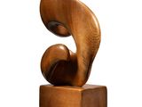 wooden sculpture of an abstract shape on a white background