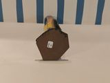 a small bird that is sitting on top of a table