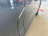a close up of a car door handle on the side of the car
