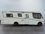 a white motorhome parked on the side of the road