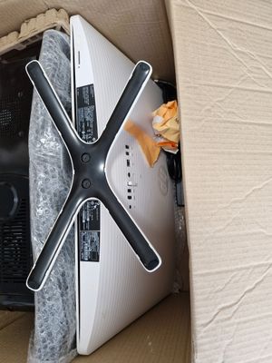 a box with a computer and a television inside of it