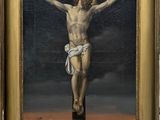 une image représentant un tableau de Jésus sur la croix, avec un crâne au premier plan