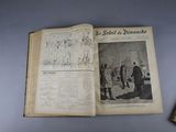an open book on a table with a picture of a man