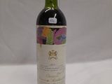 a bottle of wine that is sitting on a table