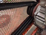 a close up of a machine that is working on a piece of metal