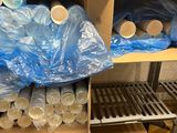 many plastic cups on a shelf in a store