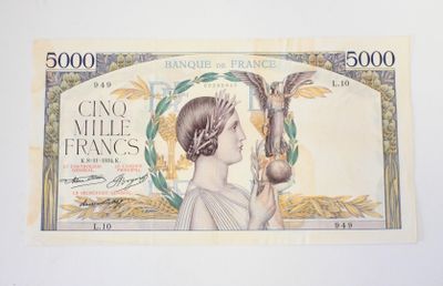 a picture of a bank note with a woman holding a plant