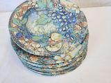 a lot of plates that are sitting on a table