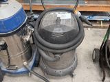 two vacuums sitting next to each other on the floor