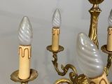 a chandelier that has five lights on it