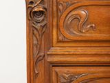 an image of a wooden cabinet with a marble top on a wooden floor
