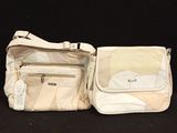 two pieces of luggage that are sitting on a black surface