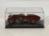 a small model of a car in a clear box