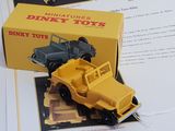 a toy truck that is sitting on top of a book