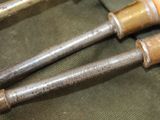 three old tools that are sitting on a table
