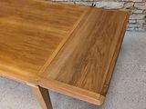 an image of a wooden table with two leaves on it