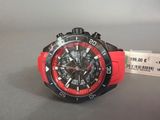 the watch is red and black and has a tag on it