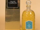 an image of a bottle of cologne next to a box of cologne