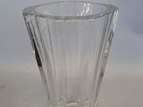 a glass vase that is sitting on a table