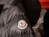 a black jacket with a patch on the back of it