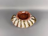 a picture of a ceramic candle holder on a table