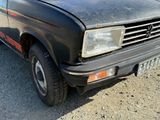 a black truck that is parked on the side of the road