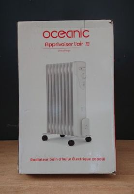 packaging of a white electric radiator sitting on top of a wooden table
