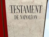 the book is open on a white surface with a red cover
