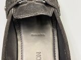 a close up of a pair of shoes on a white surface
