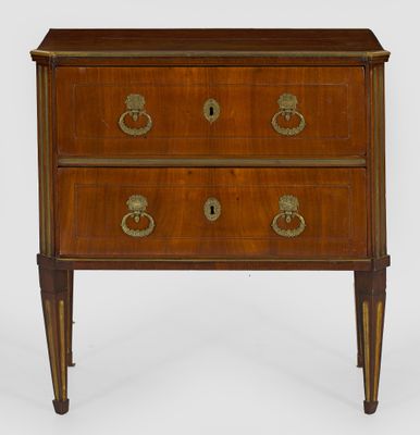 a wooden chest of drawers with brass handles and drawers