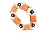an image of a bracelet with orange and blue beads on a white background