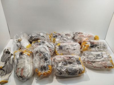 a lot of fish wrapped in plastic bags on a white table