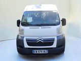 a small white van that is parked on a white surface