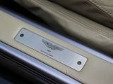 a close up of a metal plate on the door handle of a car