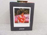 a picture of a woman holding a dog in a box