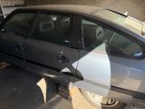 an image of a car that is parked in a garage