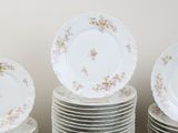 many plates stacked on top of each other on a table