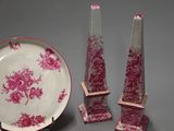 three pieces of pink and white porcelain on a gray surface
