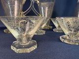 four glasses that are sitting on a table