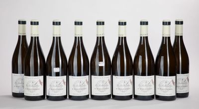 six bottles of wine lined up in a row on a table