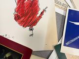 a pile of old postcards on a table