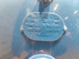 a close up of a blue car with a tag on it