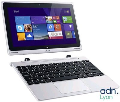 a laptop with a keyboard and a mouse on top of it