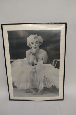 marilyn monroe in a tutu posing for a picture in a black and white photo