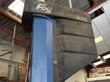 an image of a car being worked on in a garage
