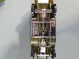 a toy car that is made out of metal and has a clock on the front of it